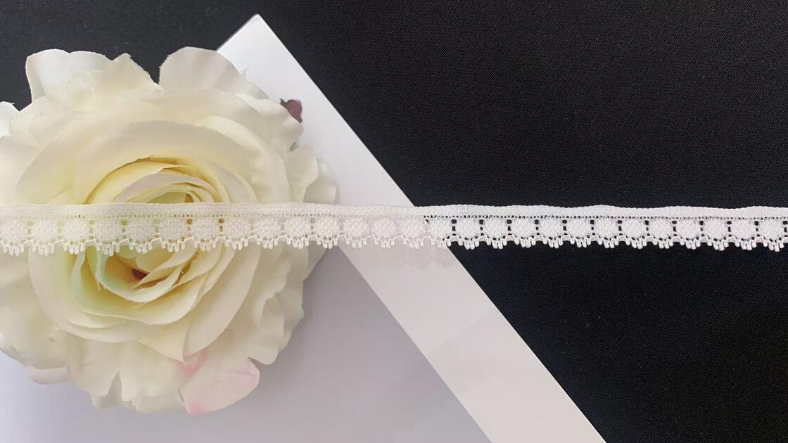 Quality 1.2cm Delicate White Knitted Lace Trim with Hollow-out Pattern & Tassel Edge for Lingerie, Dresses, and Garment Decoration factory