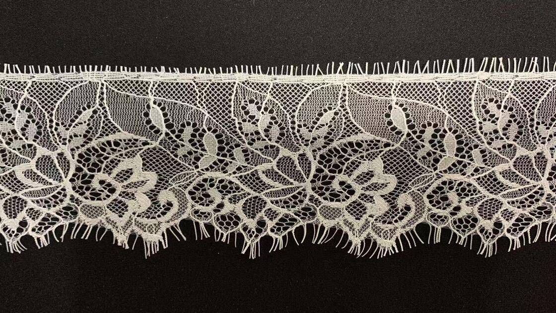 Quality Wholesale White Pure Nylon Eyelash Lace Trim with Hollow Floral Pattern and 8.5cm Width for Wedding Dresses factory