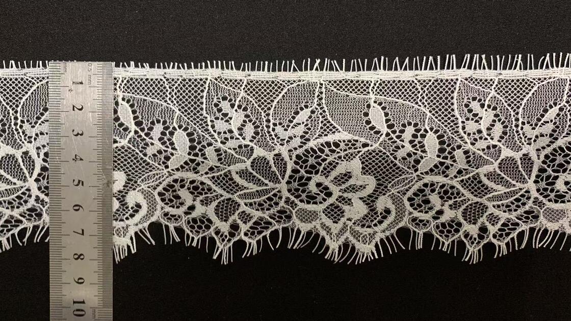 Quality Wholesale White Pure Nylon Eyelash Lace Trim with Hollow Floral Pattern and 8.5cm Width for Wedding Dresses factory