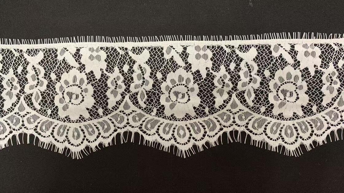Quality Pure Nylon Eyelash Lace Trim with Hollow Floral Pattern and Eyelash Fringe Edge for Garment Decoration factory