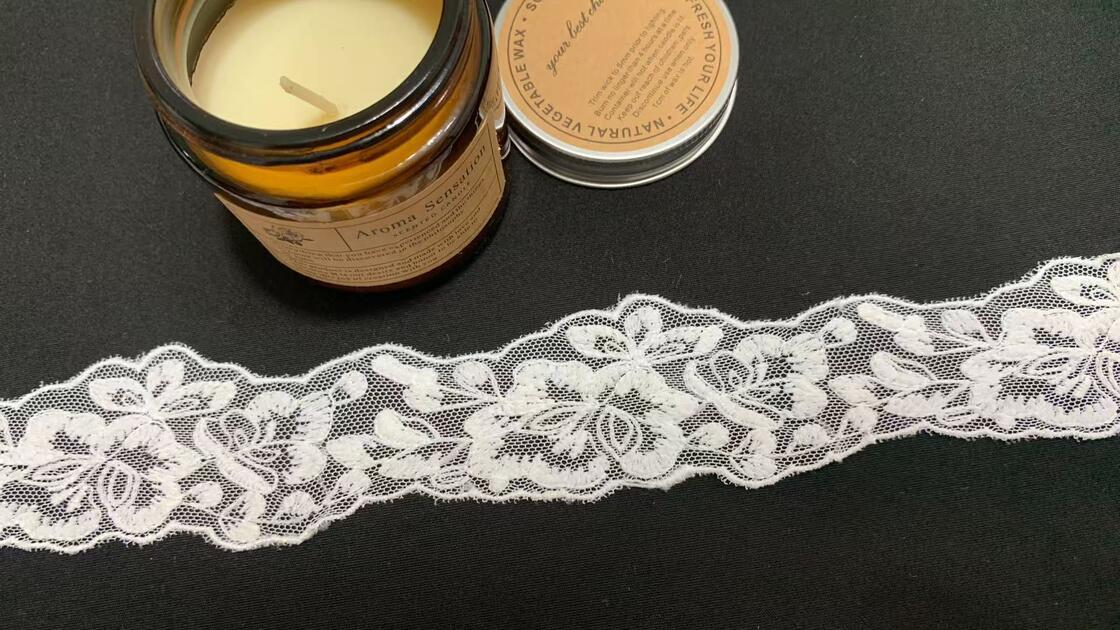 Quality 4cm Width Milk Yarn Lace Trim with Continuous Floral Pattern and Wavy Edge for Garment Trimming factory