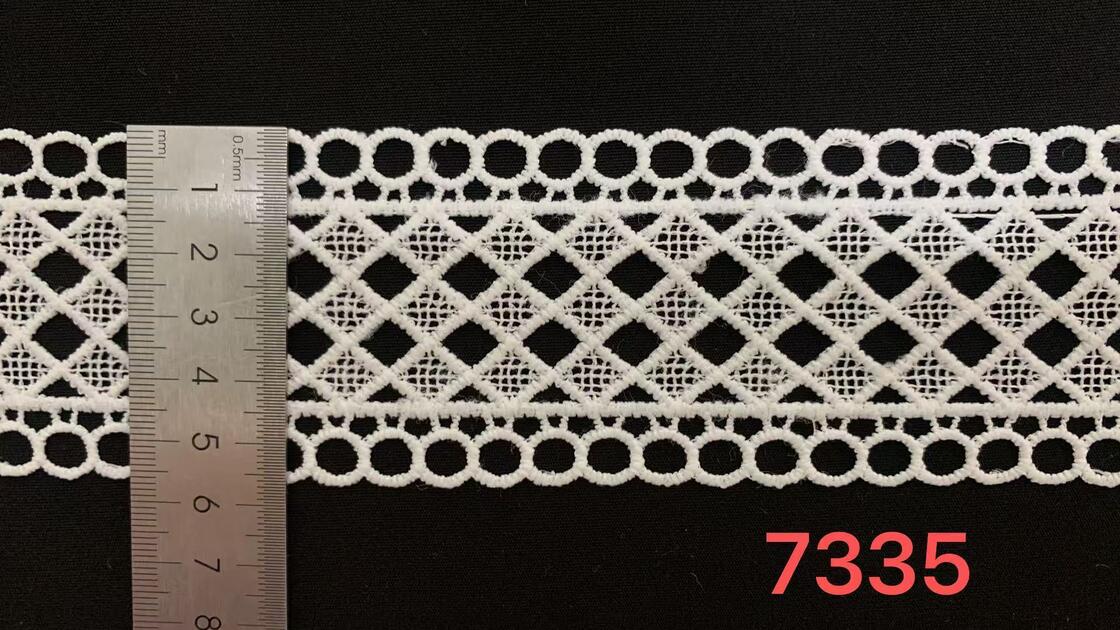 Quality 5.5cm Width Milk Yarn Lace Trim with Geometric Hollow Pattern and Neat Edge Stable Workmanship for Garment Decoration factory