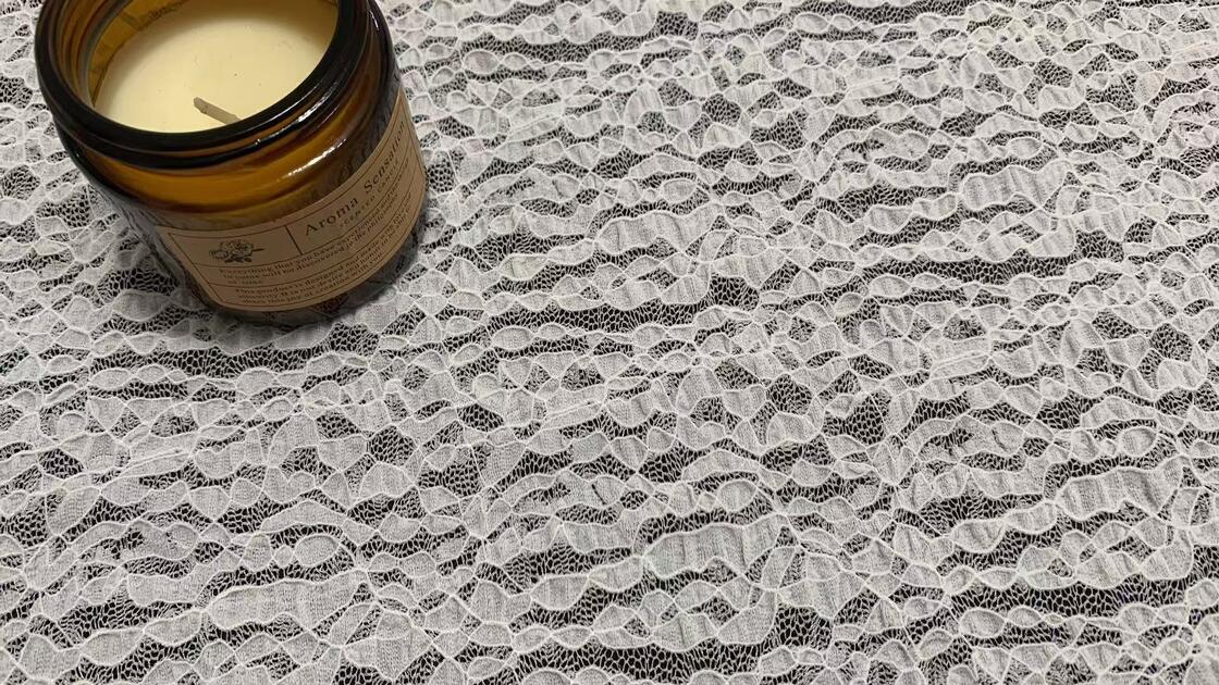 Quality Stretchy Lace Fabric with Irregular Leaf-shaped Motifs and Fine Mesh Base for Soft Elastic Feel in Dress and Ladies Apparel factory