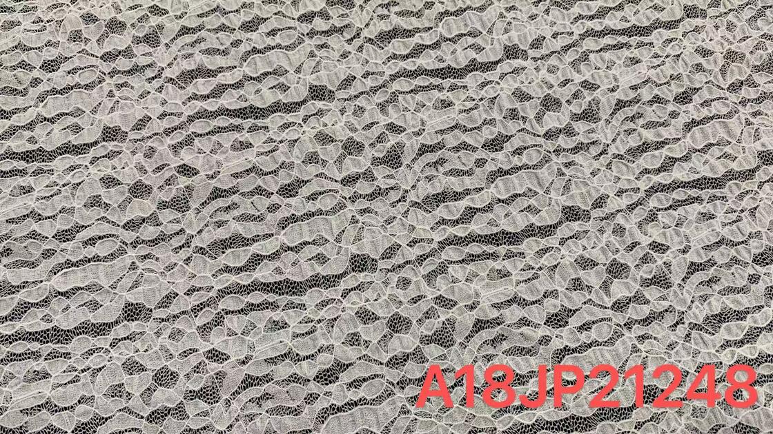 Quality Stretchy Lace Fabric with Irregular Leaf-shaped Motifs and Fine Mesh Base for Soft Elastic Feel in Dress and Ladies Apparel factory